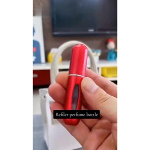 Compact perfume sprayer in hand for travel
