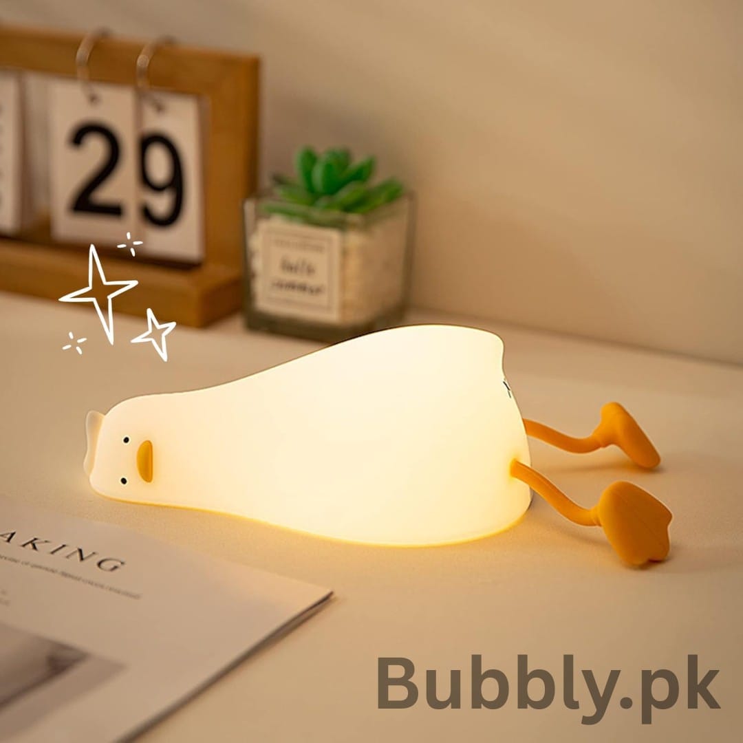 Touch-dimmable duck night lamp on wooden shelf