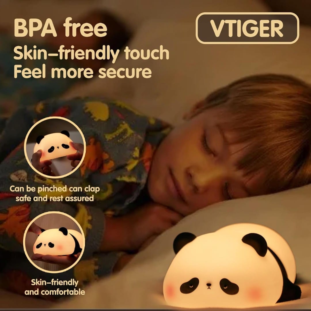 Hand tapping a glowing silicone panda night light on bedside table